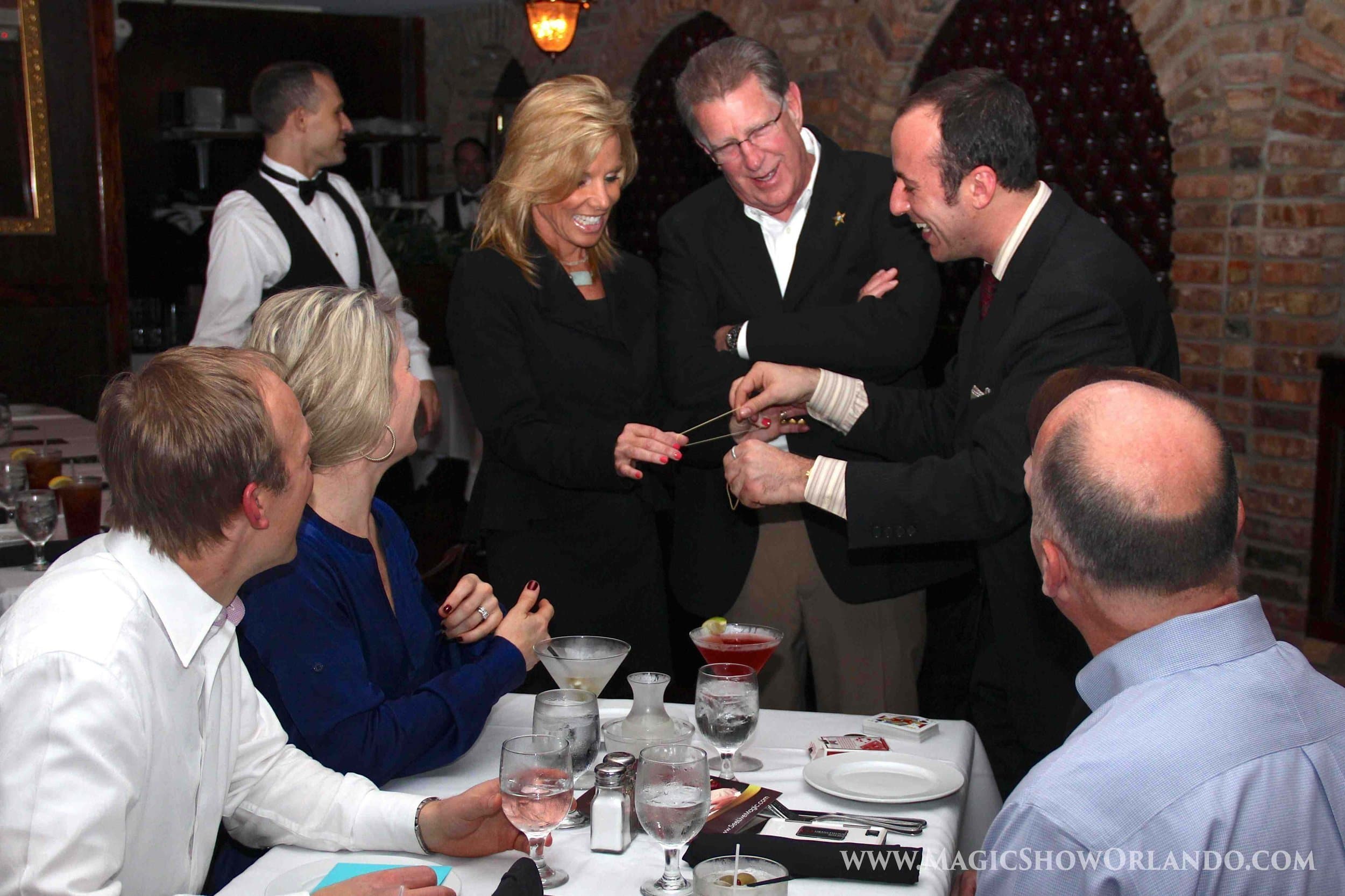 close-up magician performing intimate magic demonstration